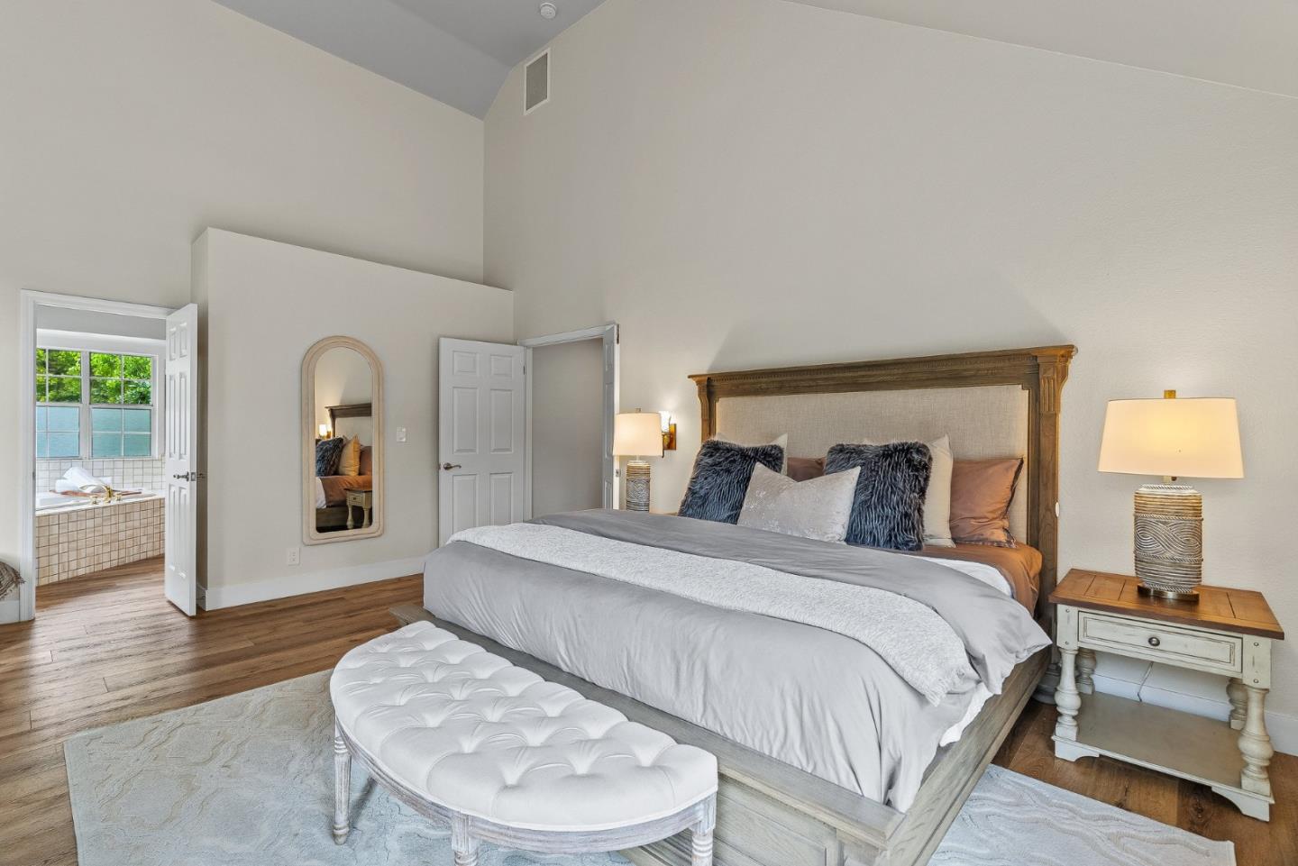 15650 Michael Lane Monte Sereno, CA 95030 - Photo 29 of 54 a bedroom with a large bed and a couch