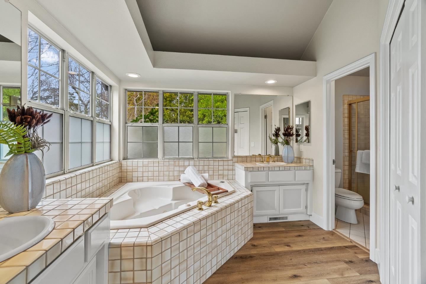 15650 Michael Lane Monte Sereno, CA 95030 - Photo 30 of 54 a bathroom with a granite countertop tub sink and mirror