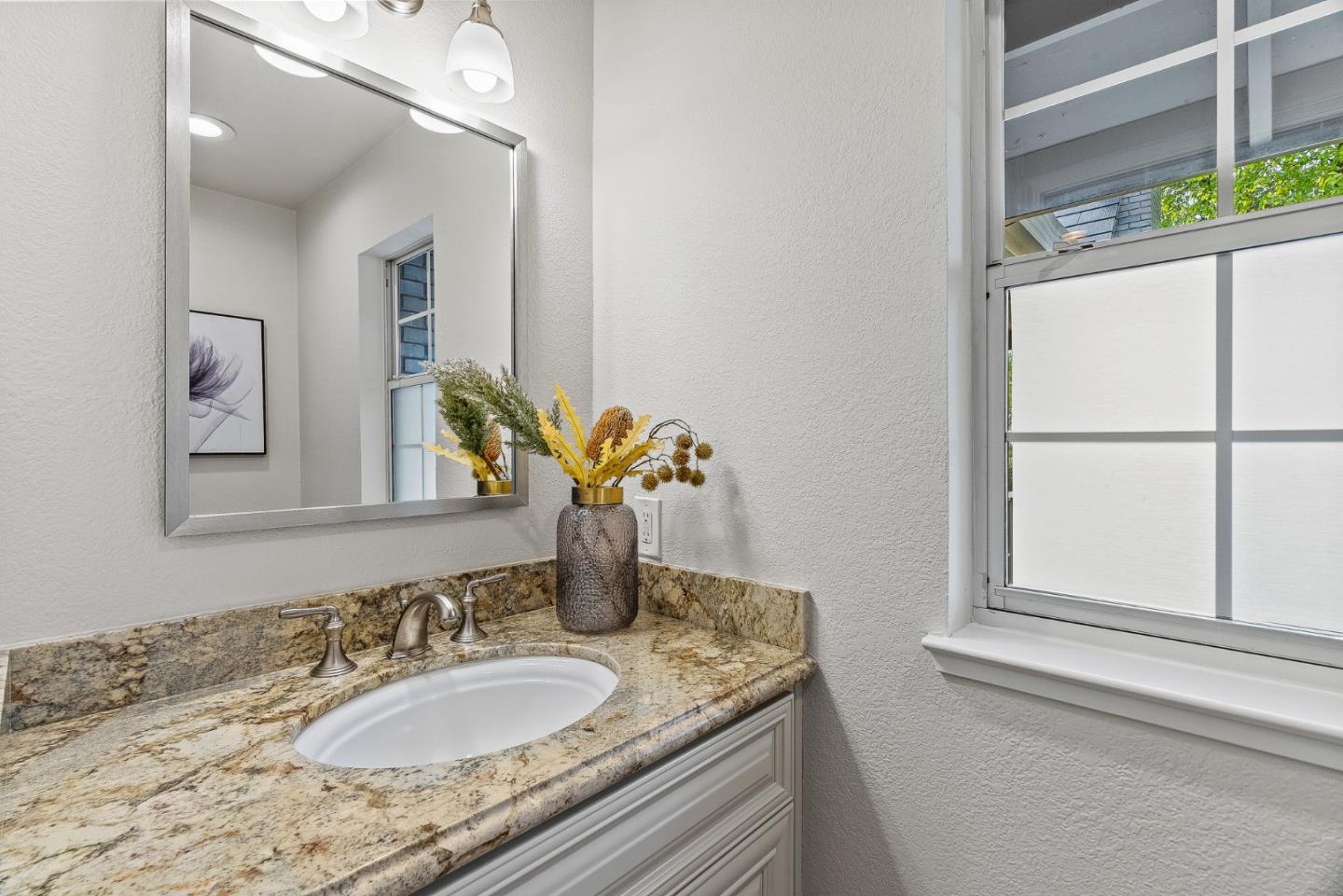 15650 Michael Lane Monte Sereno, CA 95030 - Photo 42 of 54 a bathroom with a granite countertop sink and a mirror