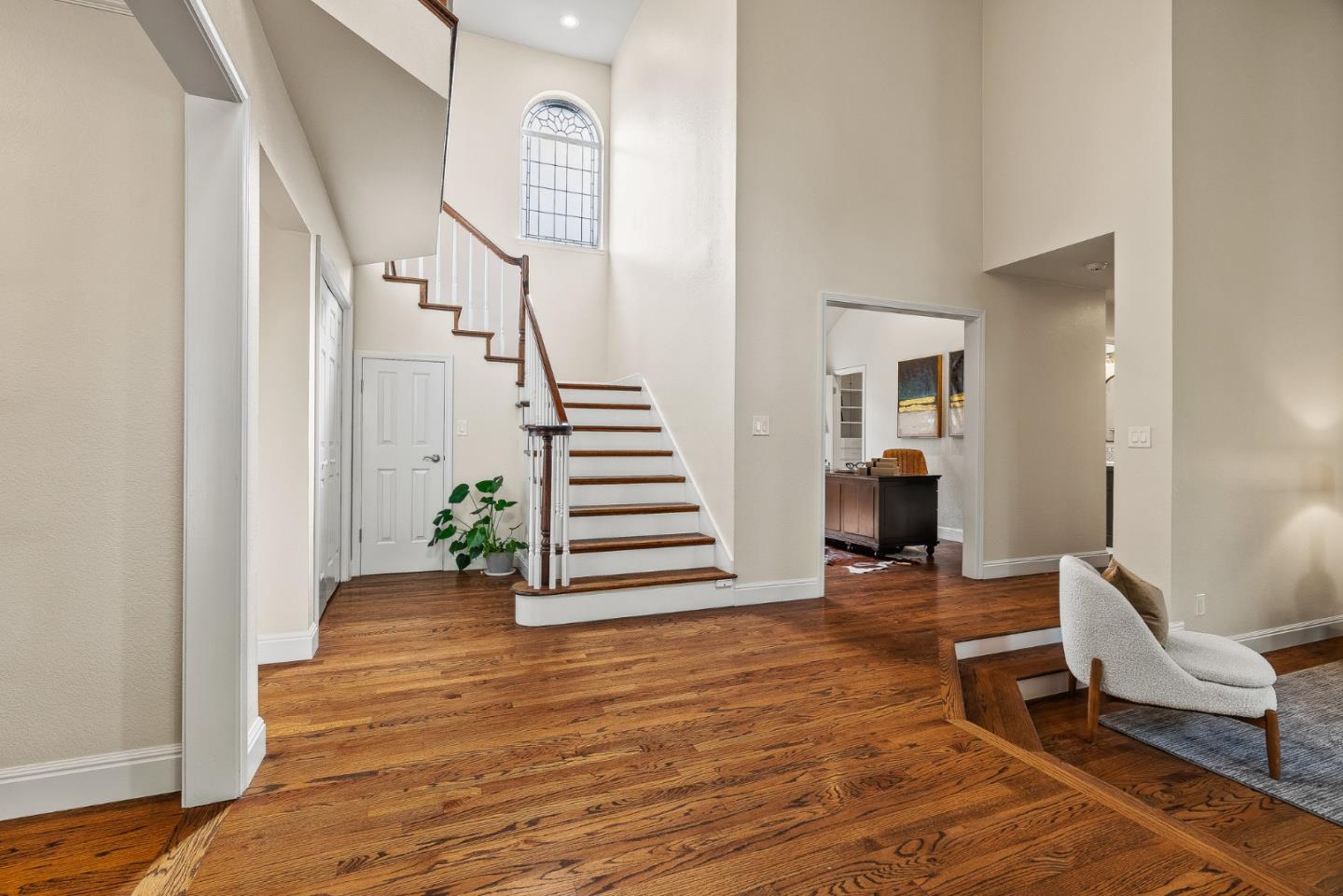 15650 Michael Lane Monte Sereno, CA 95030 - Photo 9 of 54 a view of a hallway with wooden floor and stairs