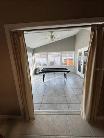 a view of a hallway with furniture
