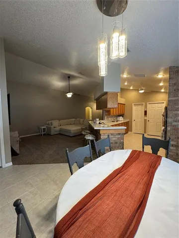 a large room with lots of white furniture