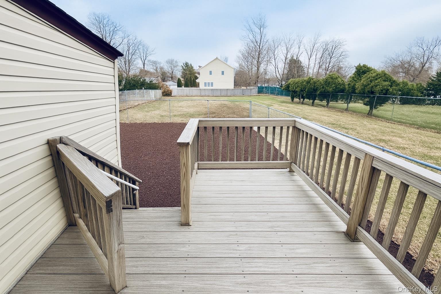 1243 Pea Pond Road North Bellmore, NY 11710 - Photo 2 of 16 a view of a balcony with wooden floor