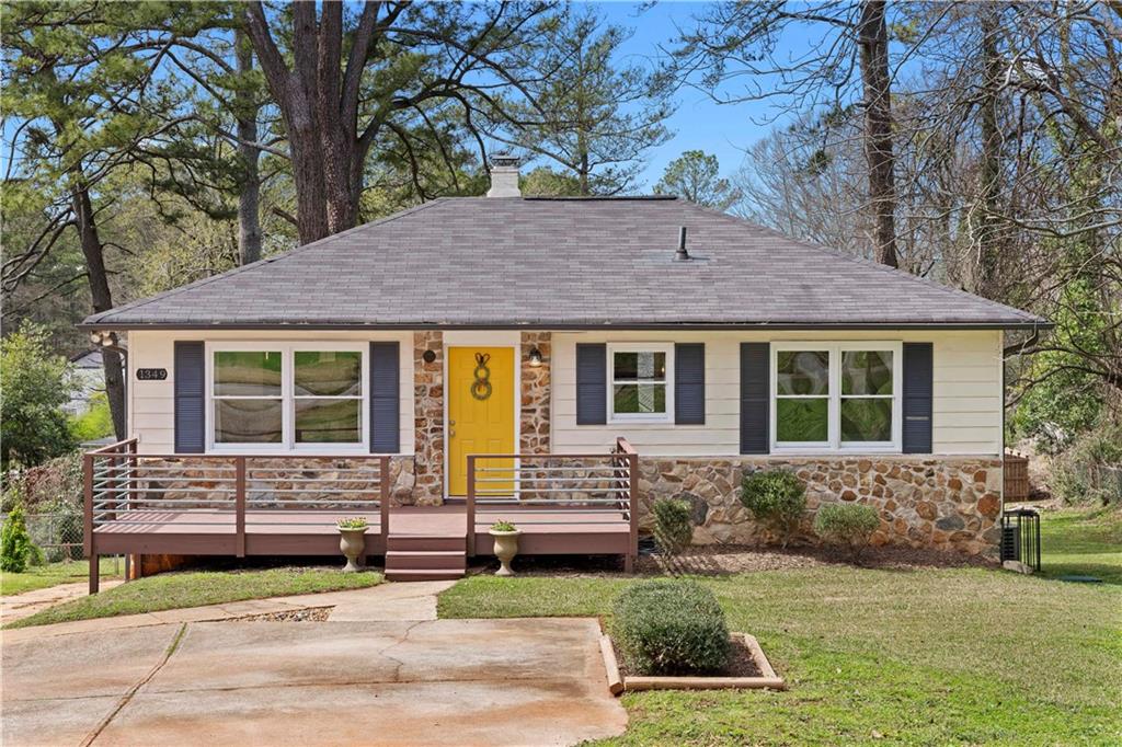 1349 Midview Drive Decatur, GA 30032 - Photo 1 of 1 a front view of a house with a garden and outdoor seating