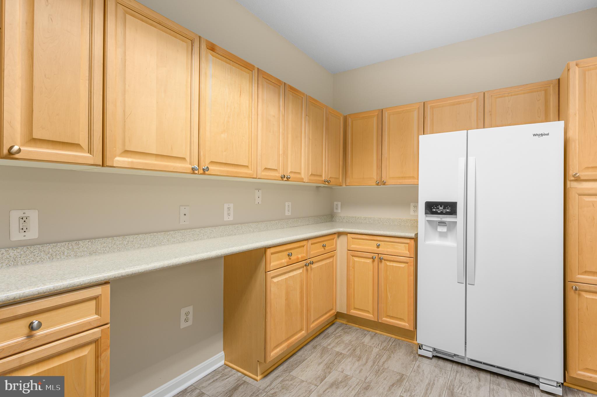 19355 Cypress Ridge Terrace, Unit 404 Leesburg, VA 20176 - Photo 11 of 39 a kitchen with stainless steel appliances a refrigerator sink and cabinets