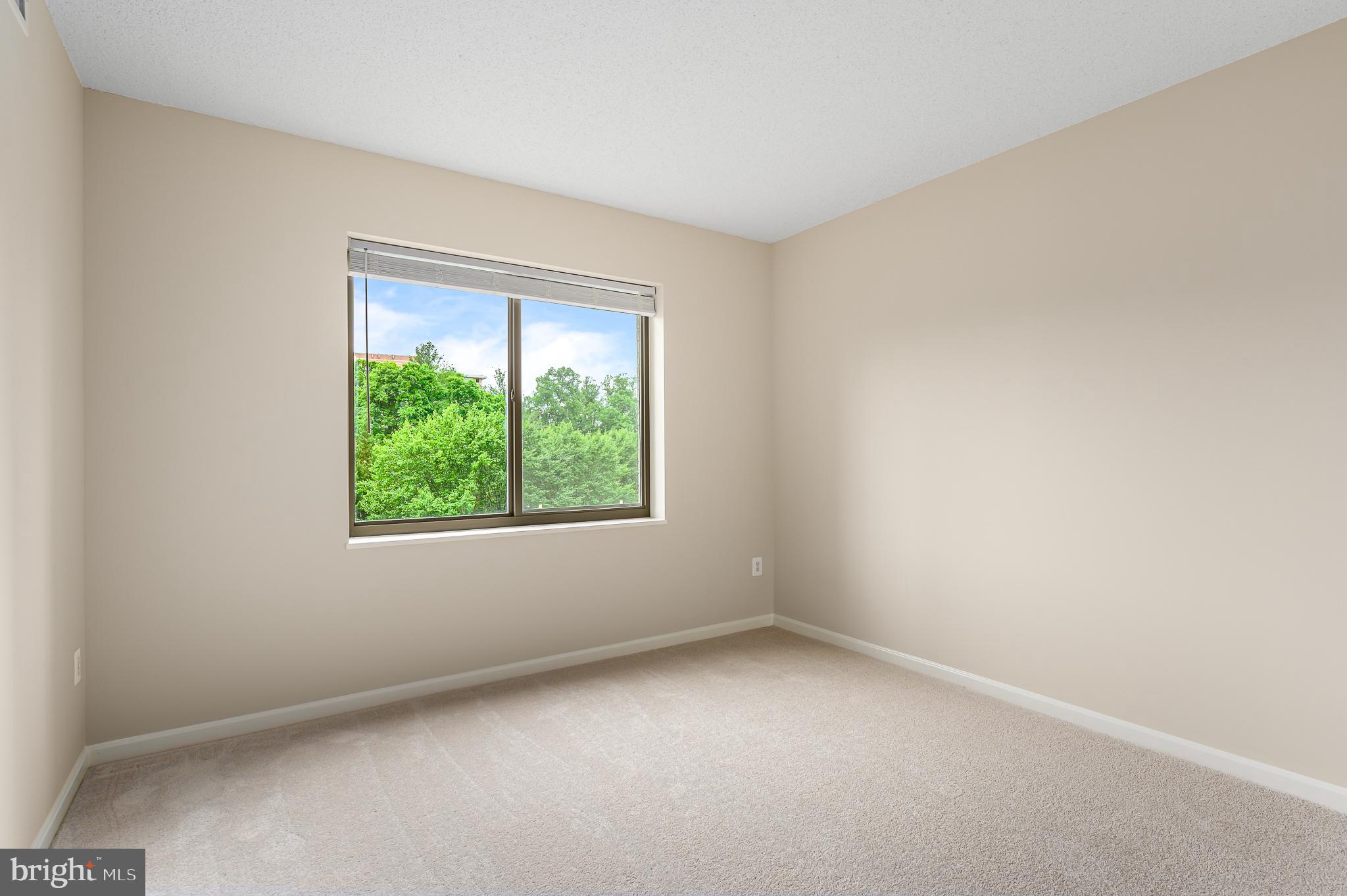19355 Cypress Ridge Terrace, Unit 404 Leesburg, VA 20176 - Photo 13 of 39 an empty room with a window