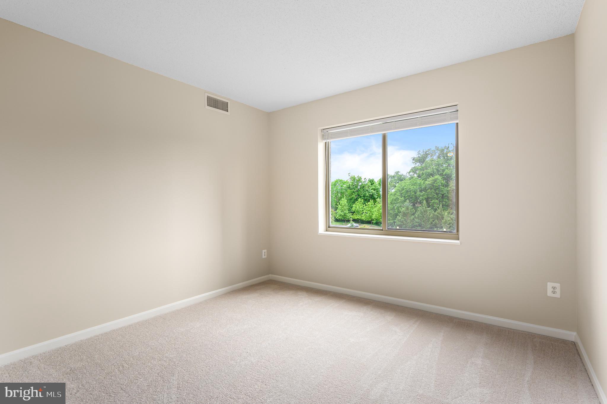 19355 Cypress Ridge Terrace, Unit 404 Leesburg, VA 20176 - Photo 14 of 39 an empty room with a window