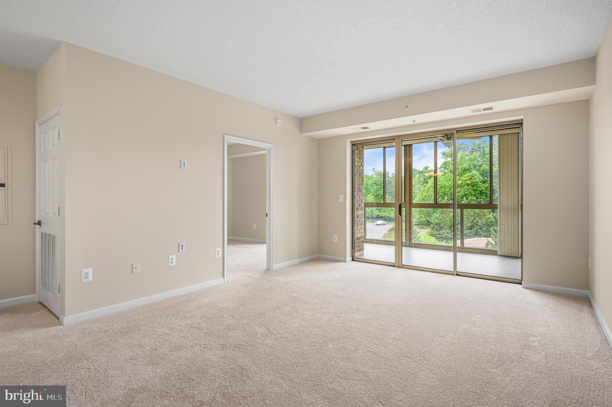 19355 Cypress Ridge Terrace, Unit 404 Leesburg, VA 20176 - Photo 2 of 39 a view of an empty room with a large window