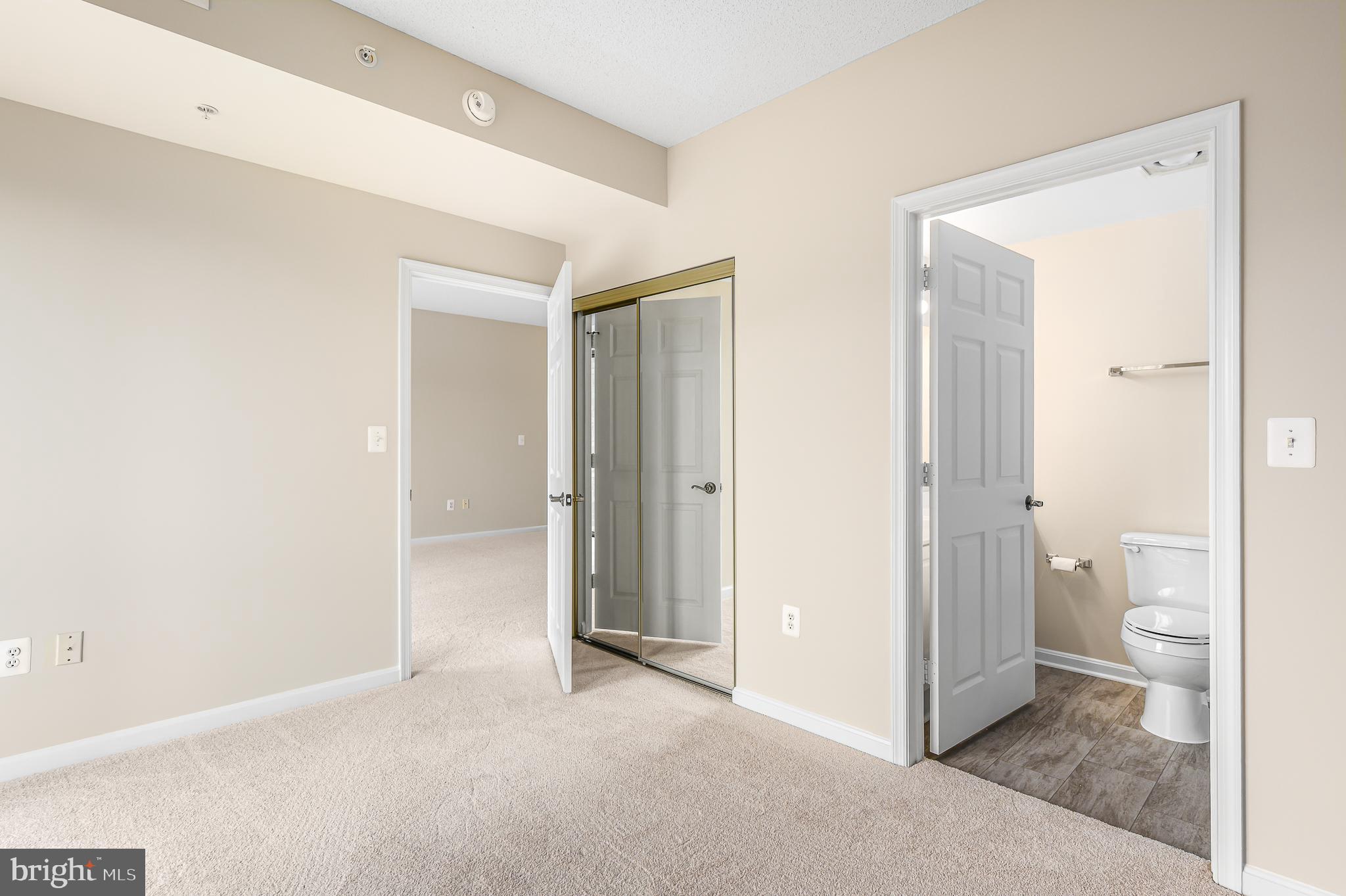 19355 Cypress Ridge Terrace, Unit 404 Leesburg, VA 20176 - Photo 20 of 39 a view of a bathroom with a toilet and a shower