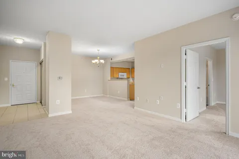 a view of a big room with window and bathroom