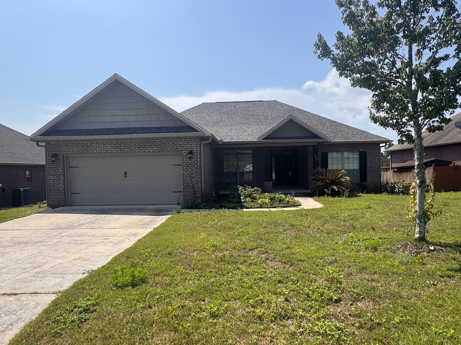 a front view of a house with a yard