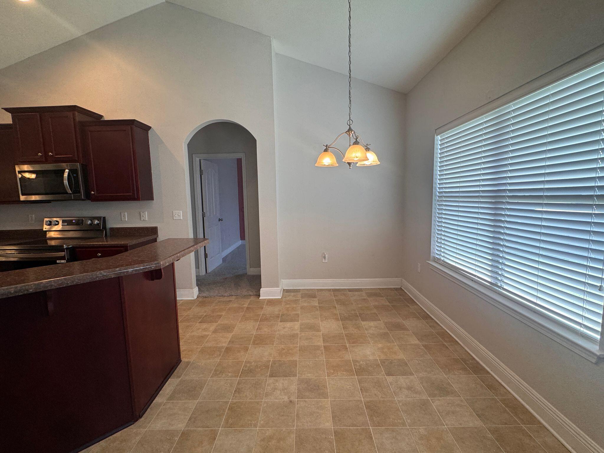 744 Lime Lane Crestview, FL 32536 - Photo 11 of 25 a view of kitchen with window and cabinets