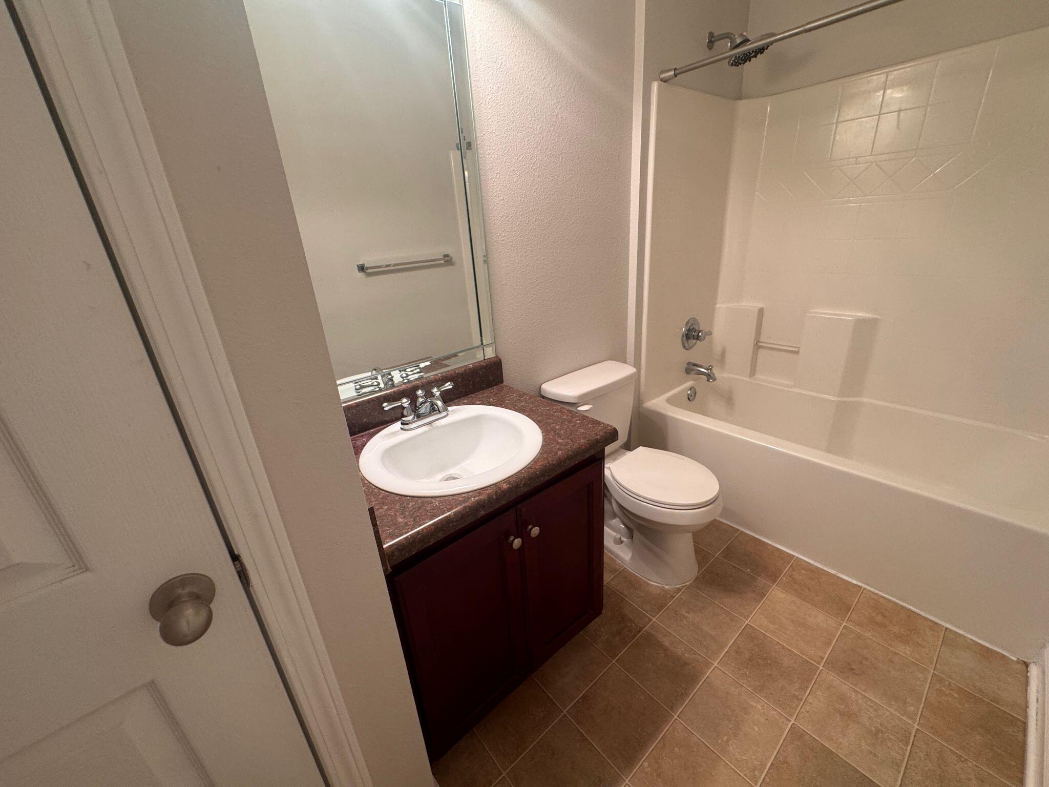 744 Lime Lane Crestview, FL 32536 - Photo 20 of 25 a bathroom with a sink a toilet and shower