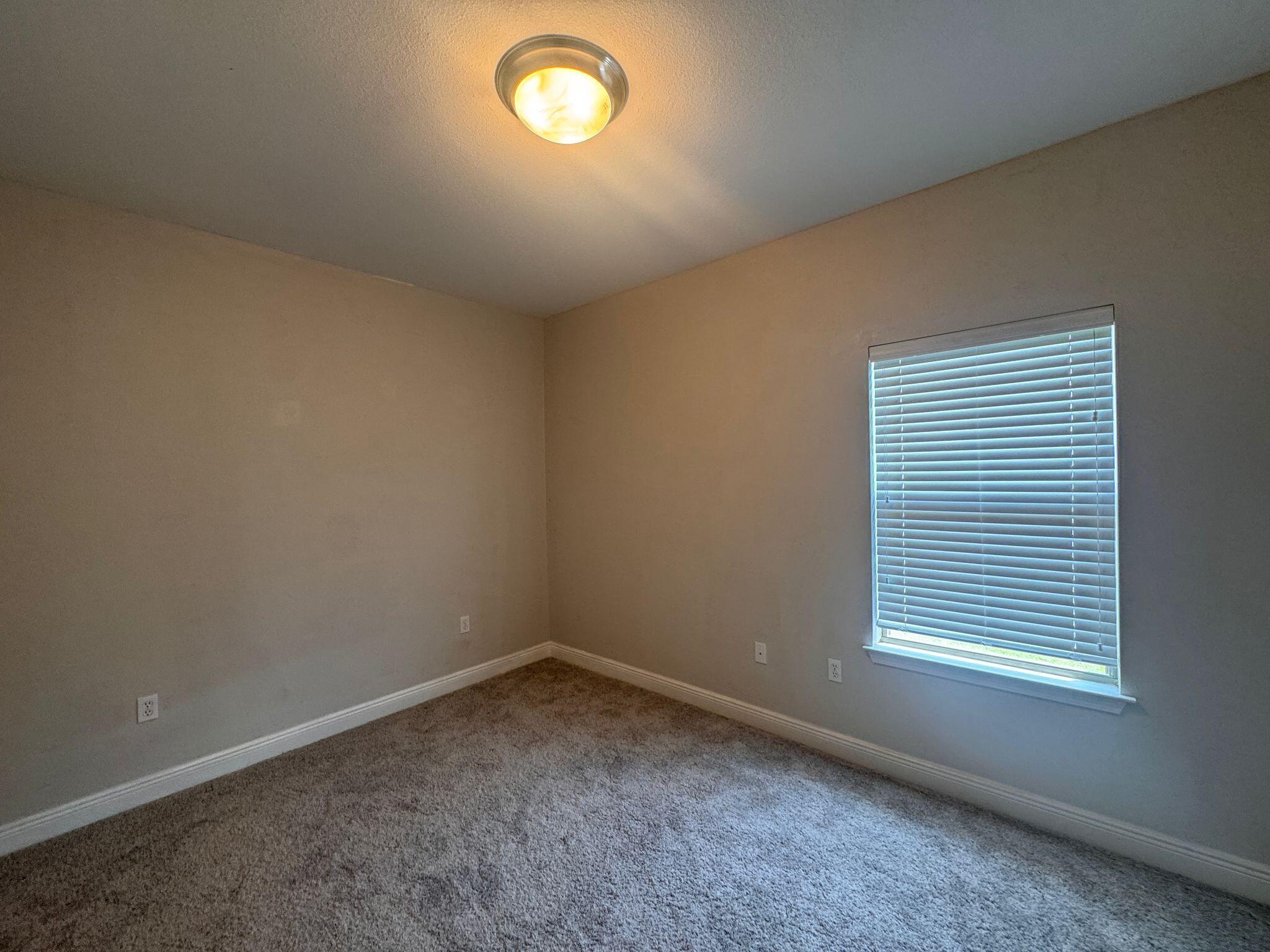 744 Lime Lane Crestview, FL 32536 - Photo 21 of 25 an empty room with a window