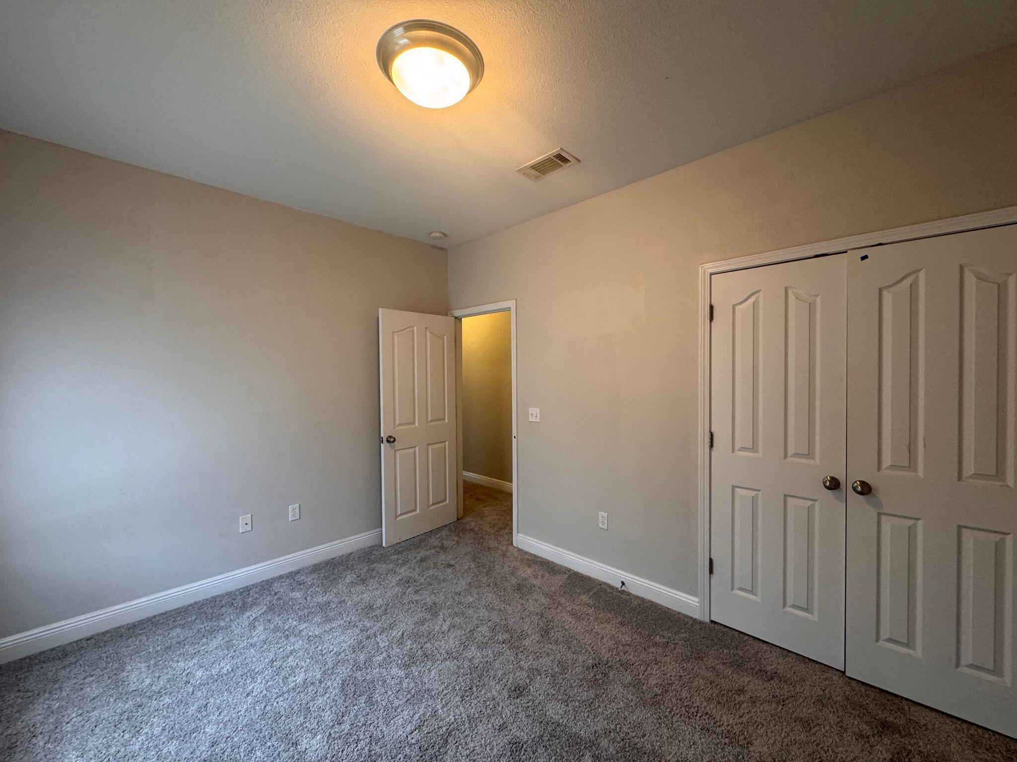 744 Lime Lane Crestview, FL 32536 - Photo 22 of 25 an empty room with windows