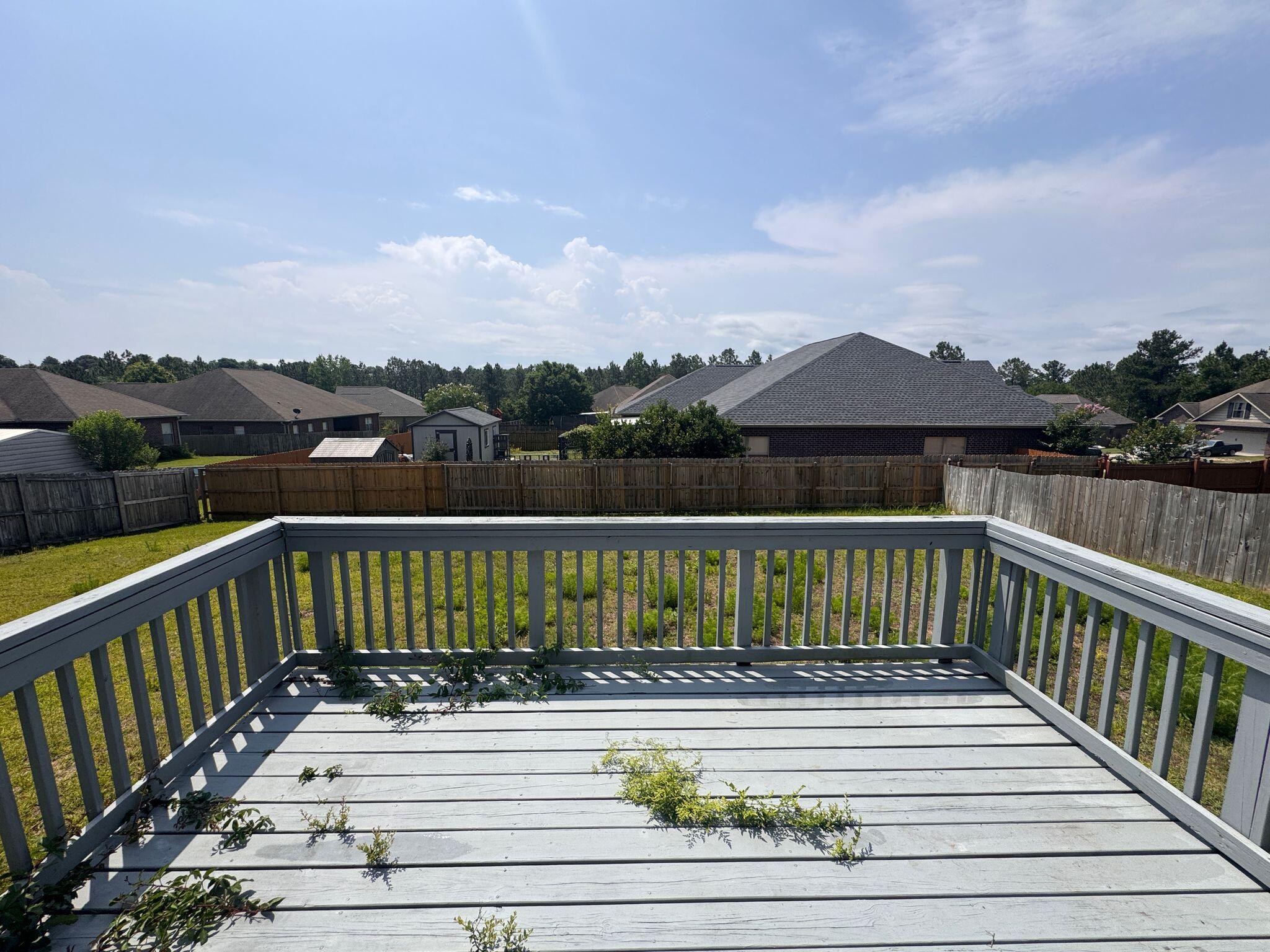 744 Lime Lane Crestview, FL 32536 - Photo 23 of 25 a view of a balcony with wooden floor