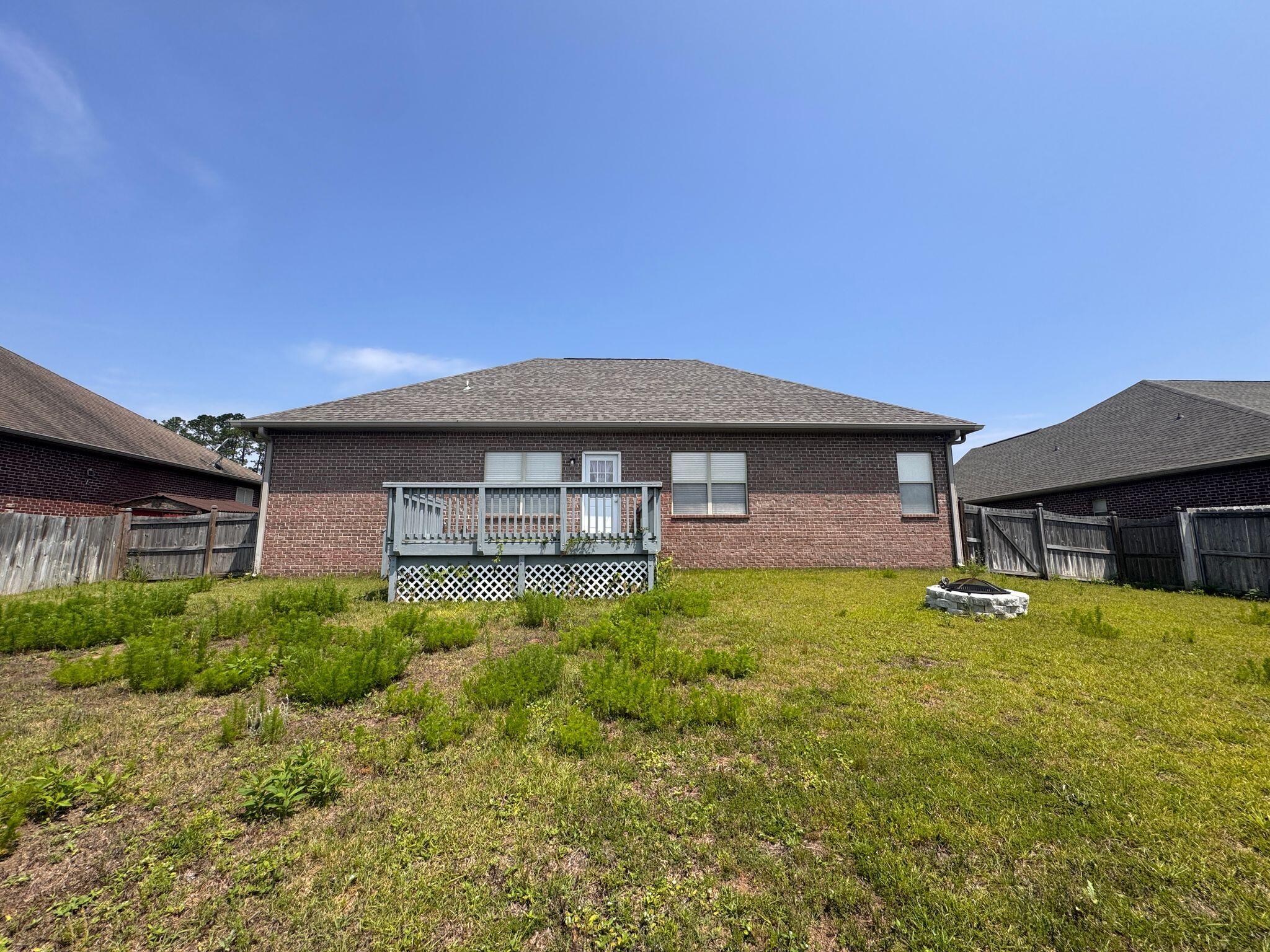 744 Lime Lane Crestview, FL 32536 - Photo 24 of 25 a front view of a house with garden
