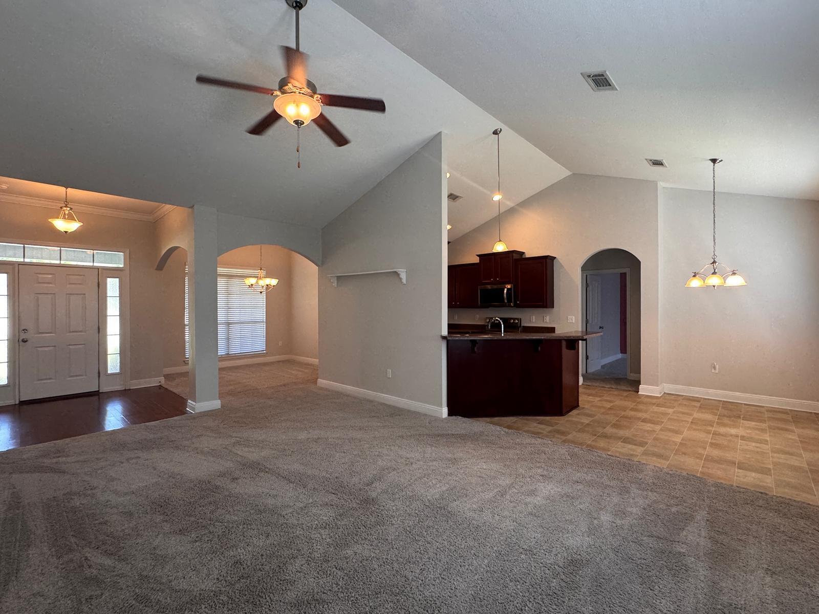 744 Lime Lane Crestview, FL 32536 - Photo 6 of 25 a view of a kitchen with a sink and cabinet