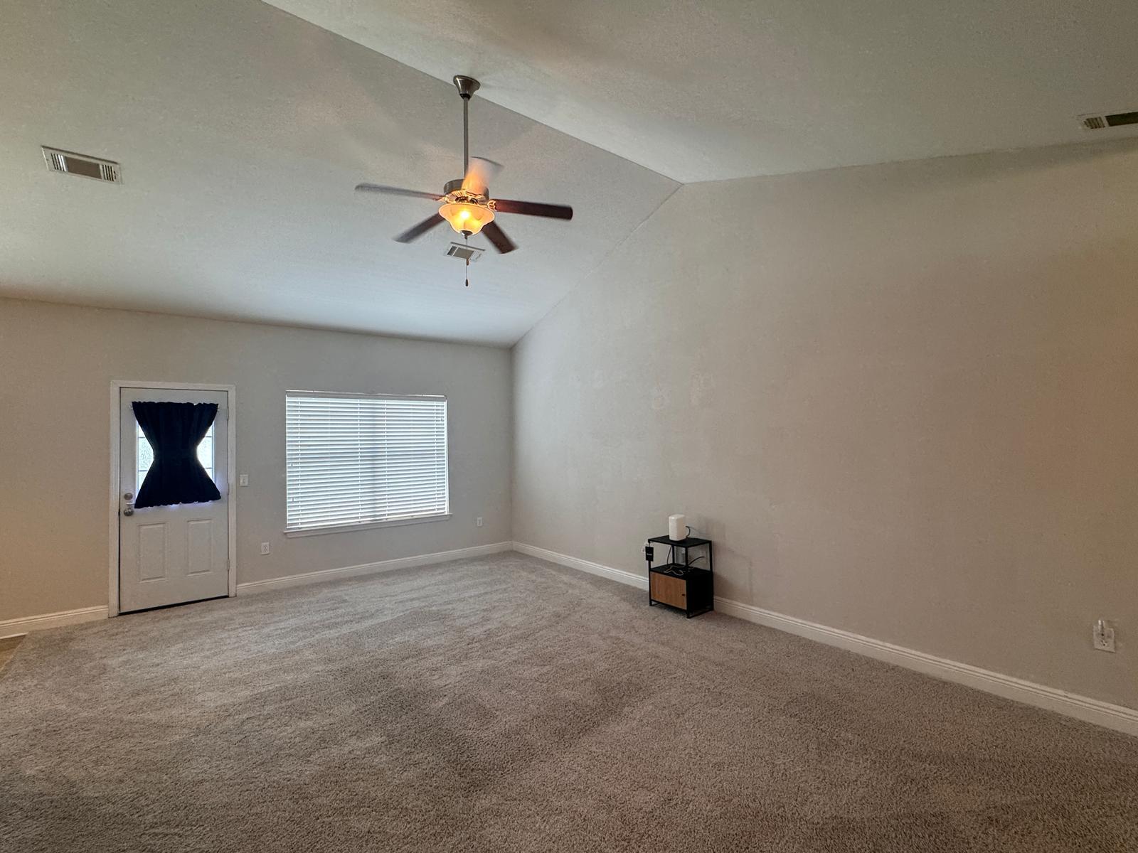 744 Lime Lane Crestview, FL 32536 - Photo 8 of 25 an empty room with a chandelier fan