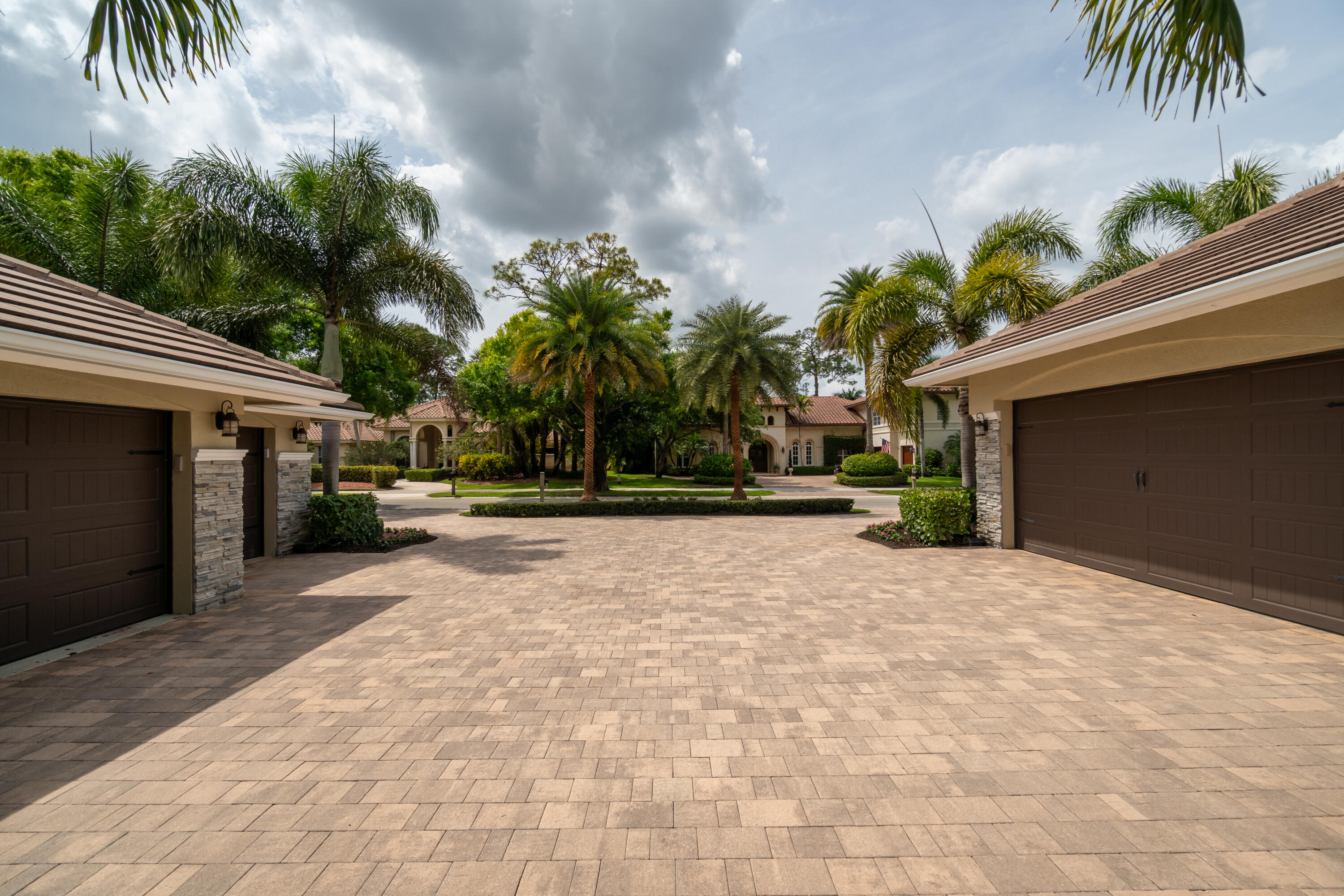 1209 Breakers W Boulevard West Palm Beach, FL 33411 - Photo 12 of 73 a house with palm tree in front of it