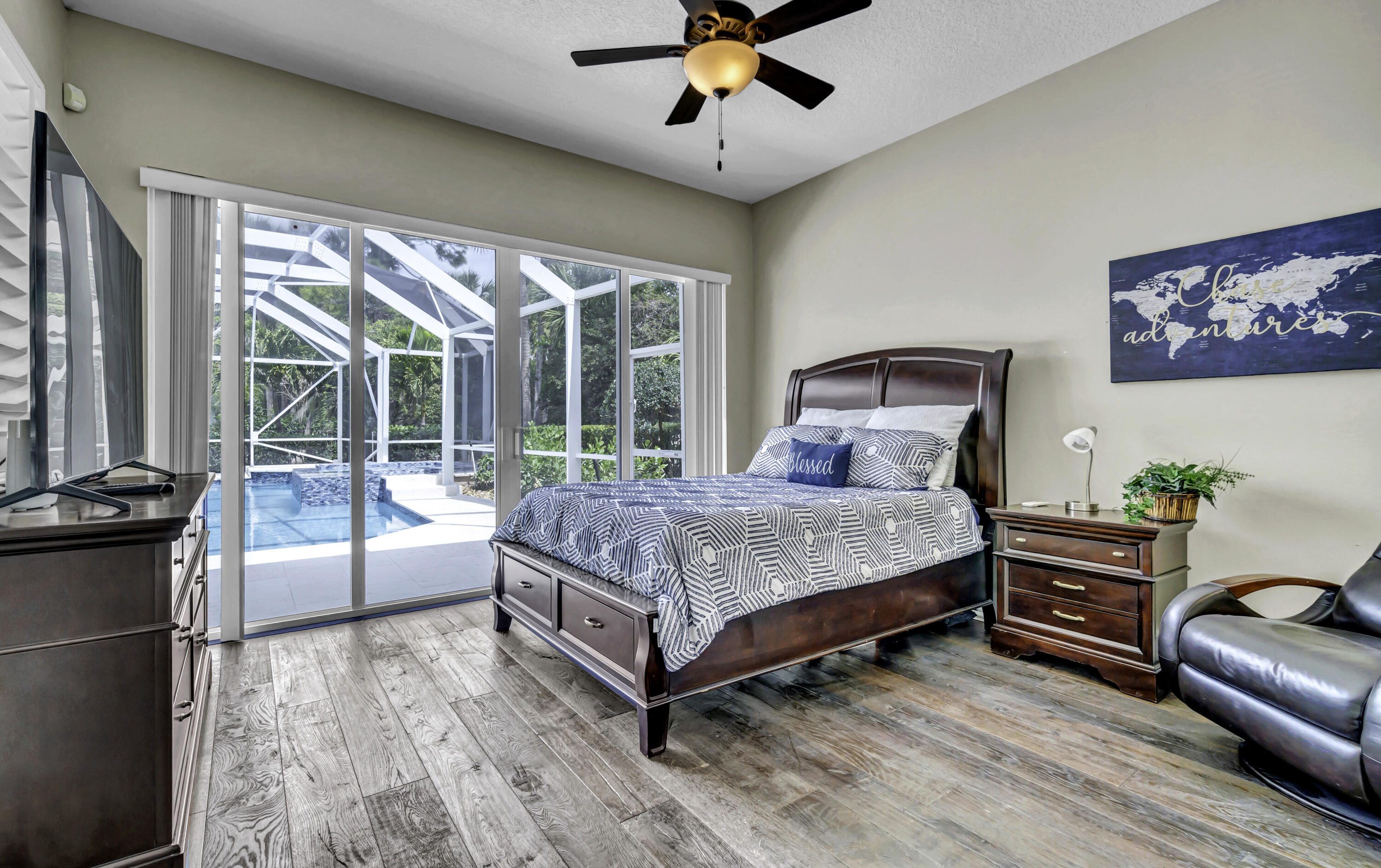 1209 Breakers W Boulevard West Palm Beach, FL 33411 - Photo 14 of 73 a bed sitting in a spacious bedroom next to a window