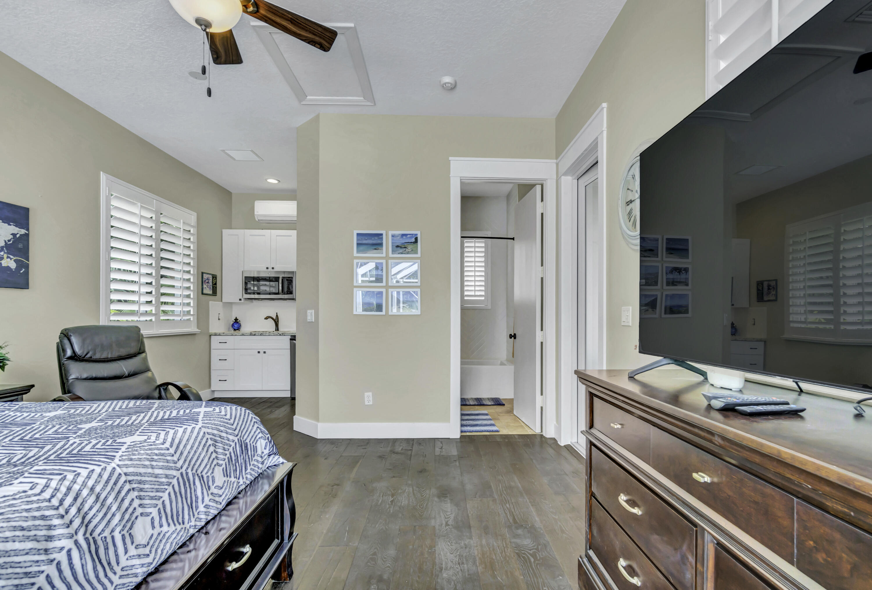 1209 Breakers W Boulevard West Palm Beach, FL 33411 - Photo 15 of 73 a bedroom with a bed and a dresser