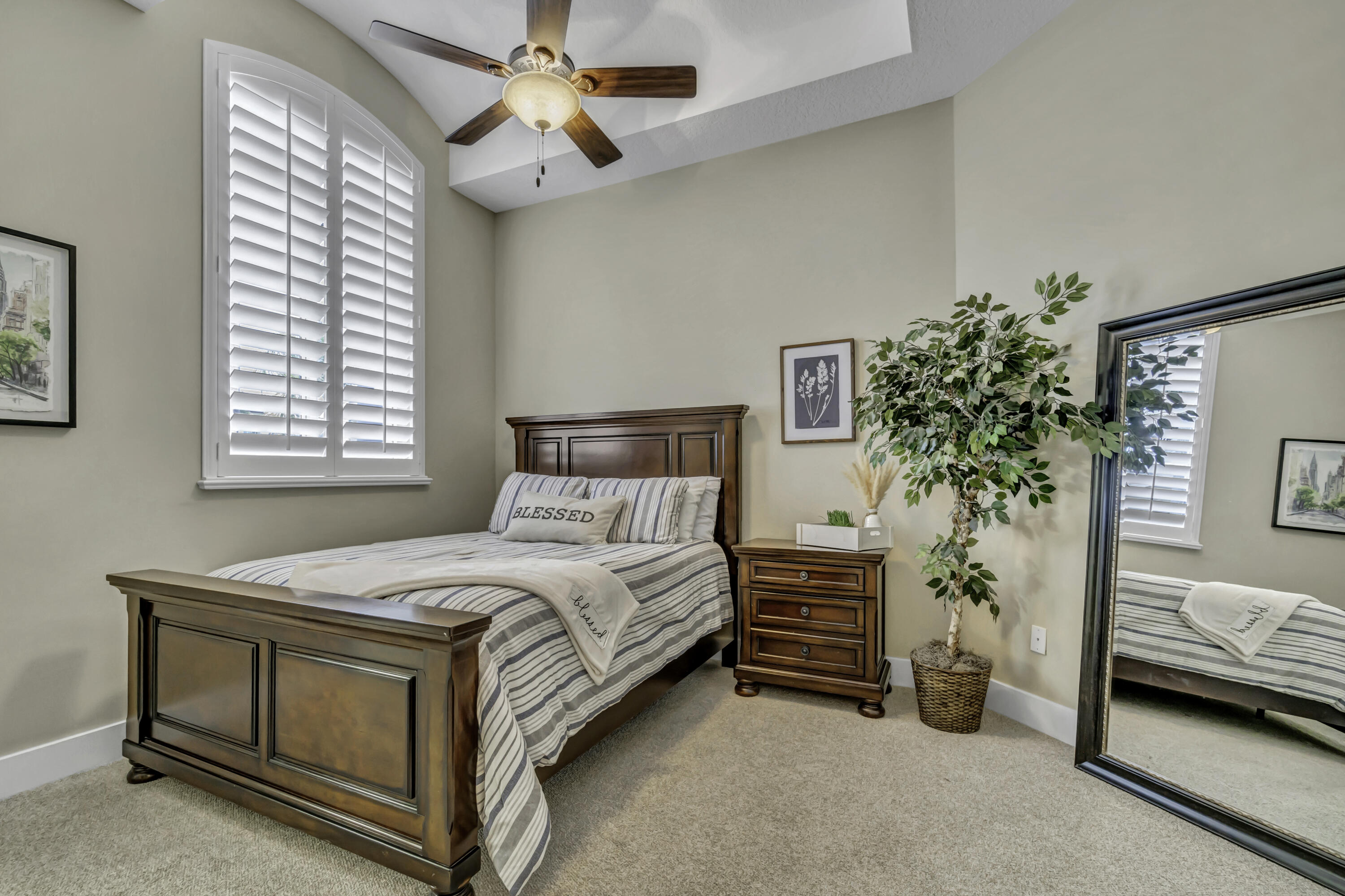 1209 Breakers W Boulevard West Palm Beach, FL 33411 - Photo 18 of 73 a bedroom with a bed and a potted plant