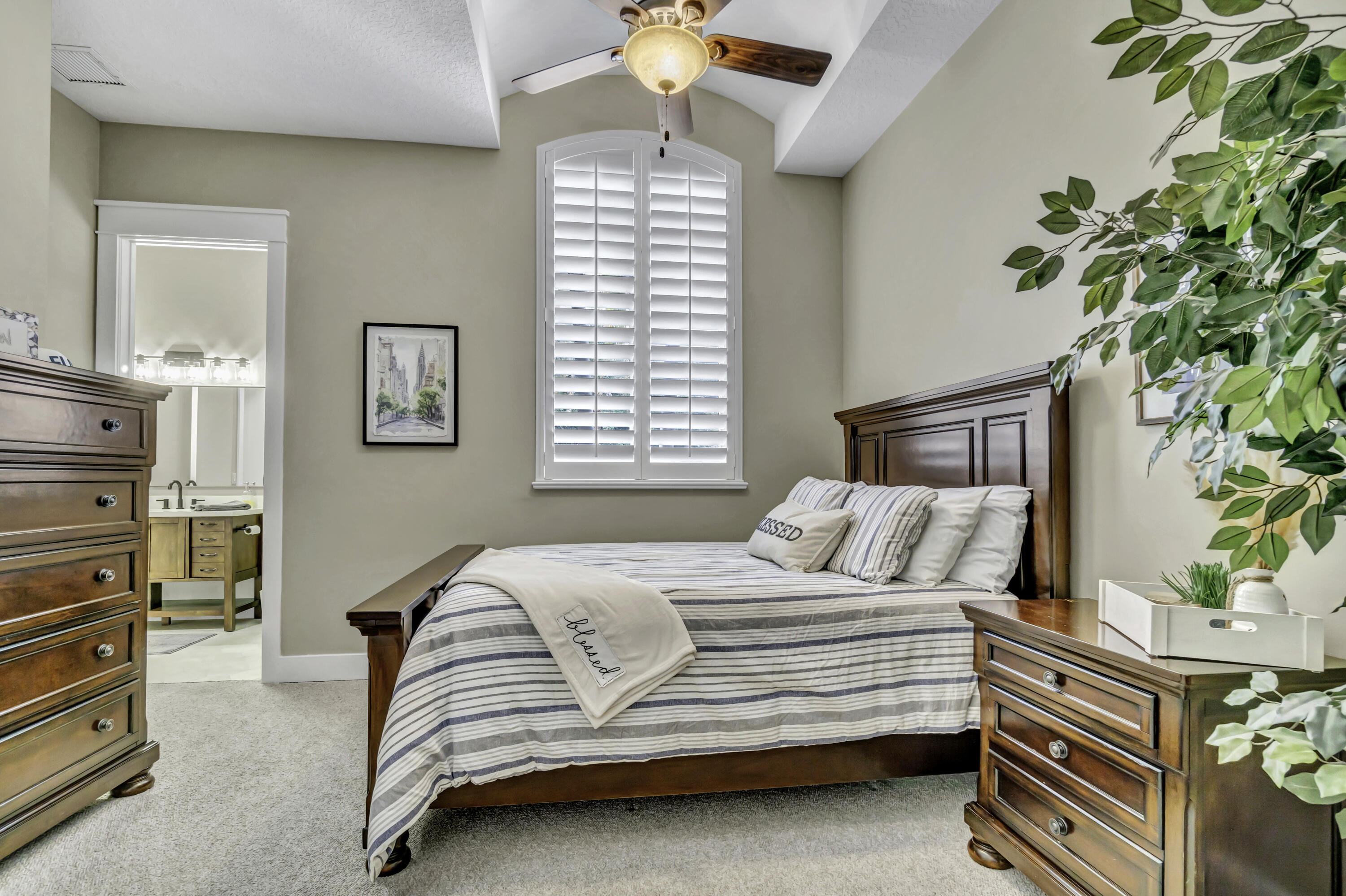 1209 Breakers W Boulevard West Palm Beach, FL 33411 - Photo 19 of 73 a bedroom with a bed and a chandelier