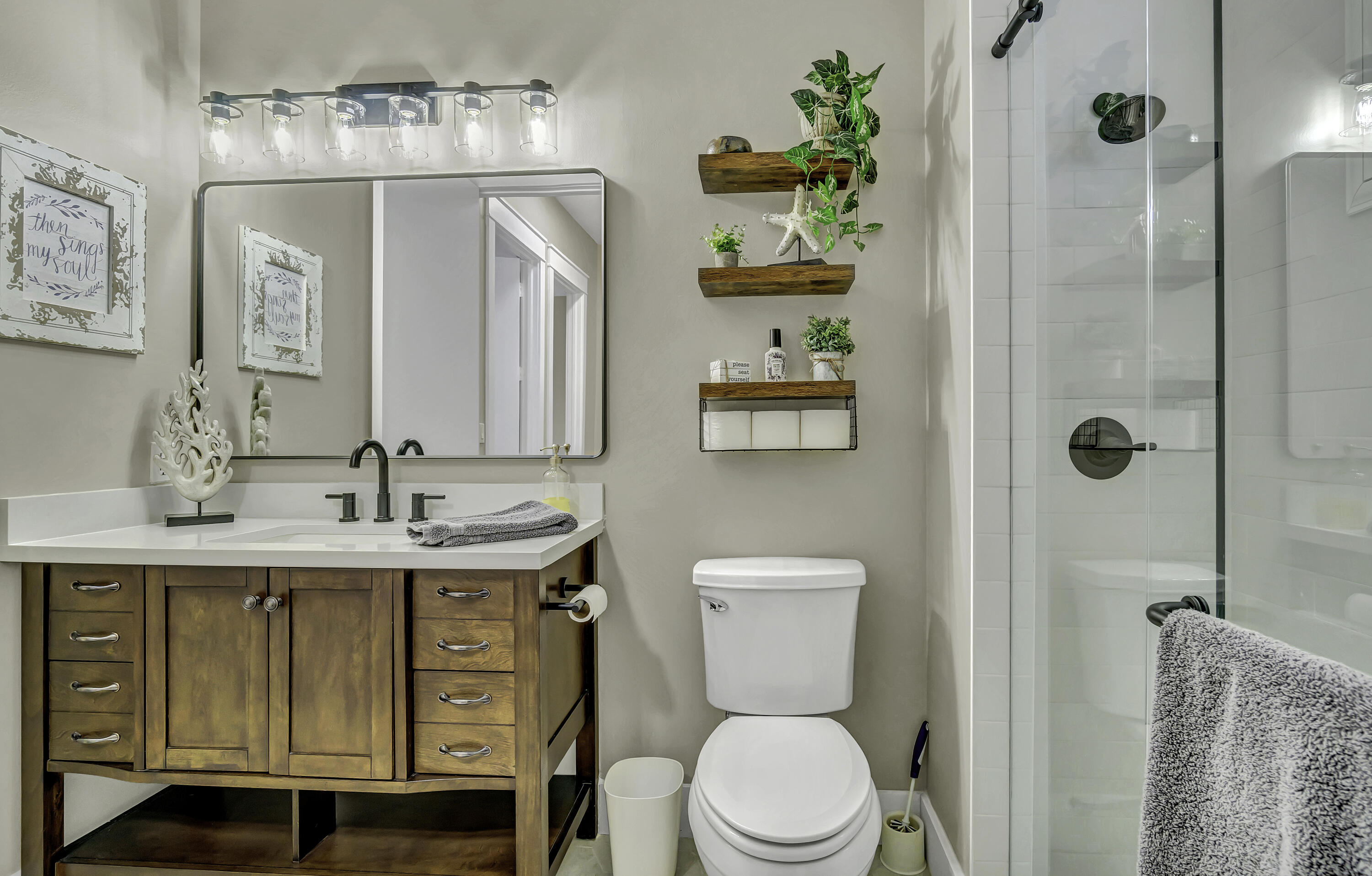 1209 Breakers W Boulevard West Palm Beach, FL 33411 - Photo 20 of 73 a bathroom with a granite countertop sink a toilet and shower