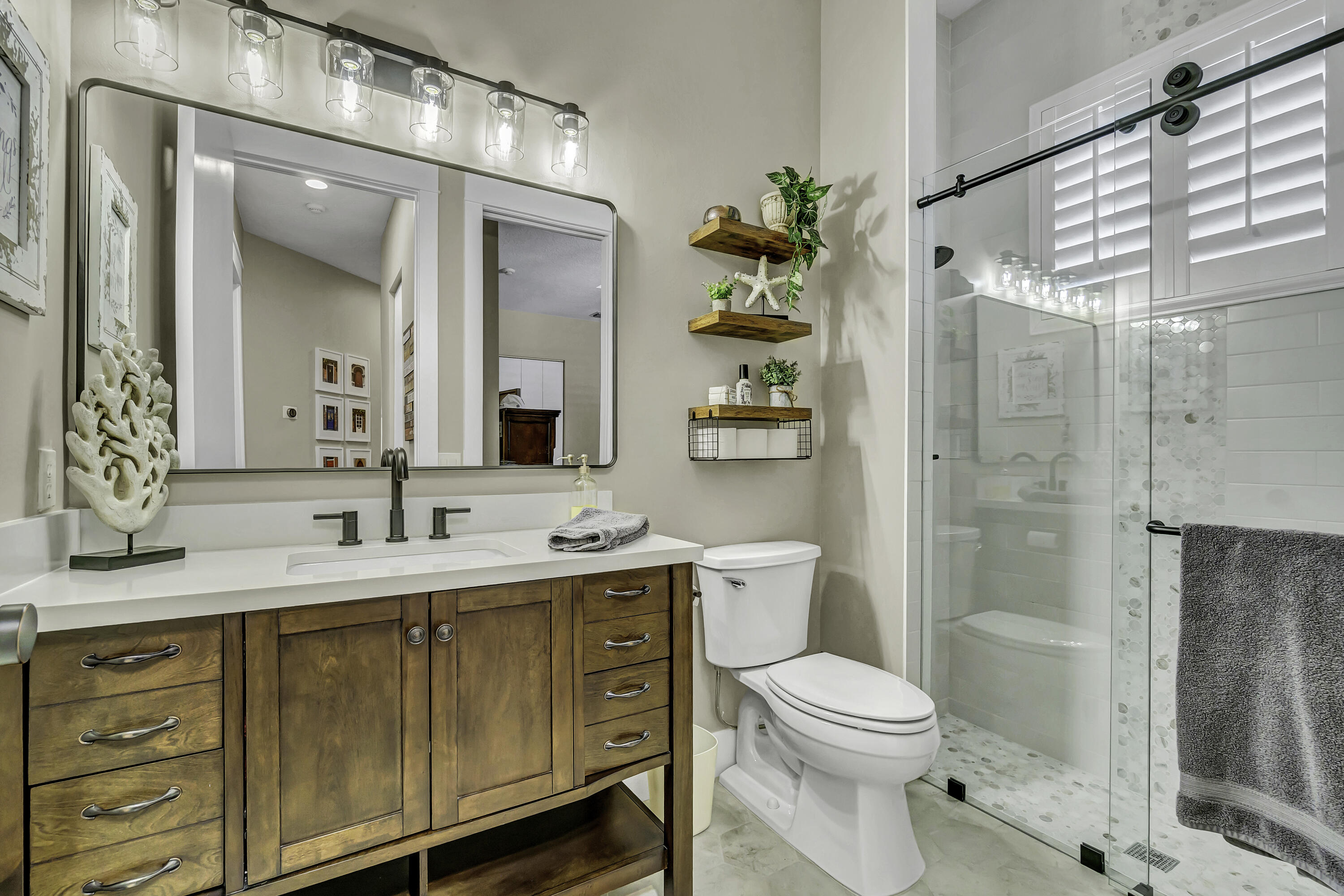 1209 Breakers W Boulevard West Palm Beach, FL 33411 - Photo 21 of 73 a bathroom with a toilet a sink and shower