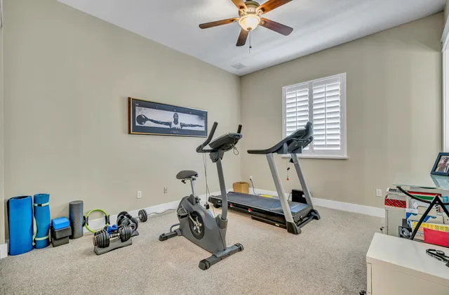 a kitchen with stainless steel appliances granite countertop a kitchen island a stove a table and chairs in it