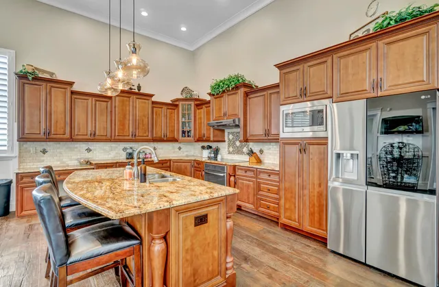 a room with pool table and windows