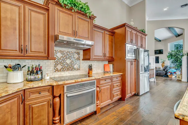 a bathroom with a sink a toilet and shower curtain