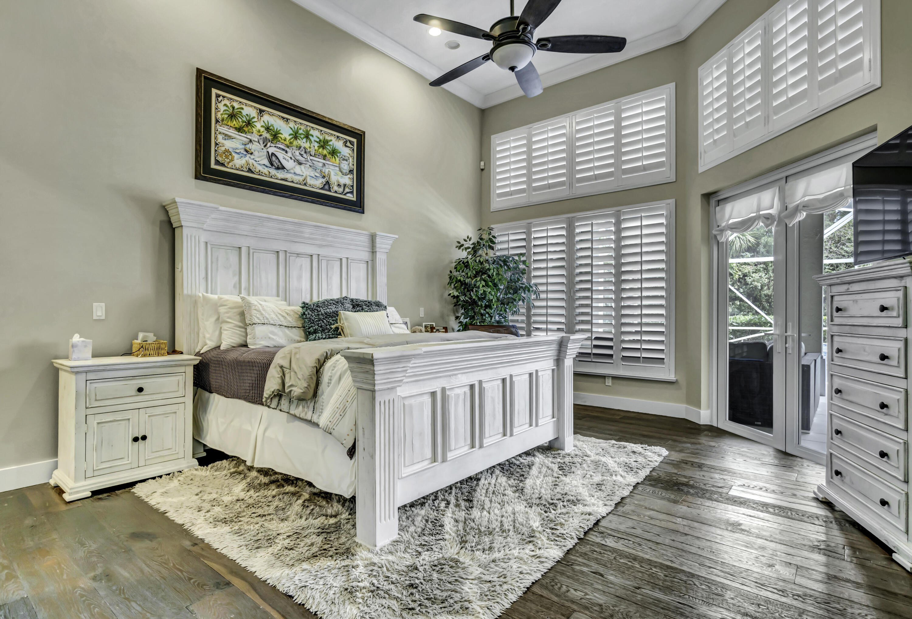 1209 Breakers W Boulevard West Palm Beach, FL 33411 - Photo 39 of 73 a bed room with a bed and a window