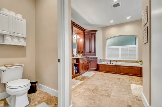 a view of a living room and dining room with furniture and floor to ceiling window