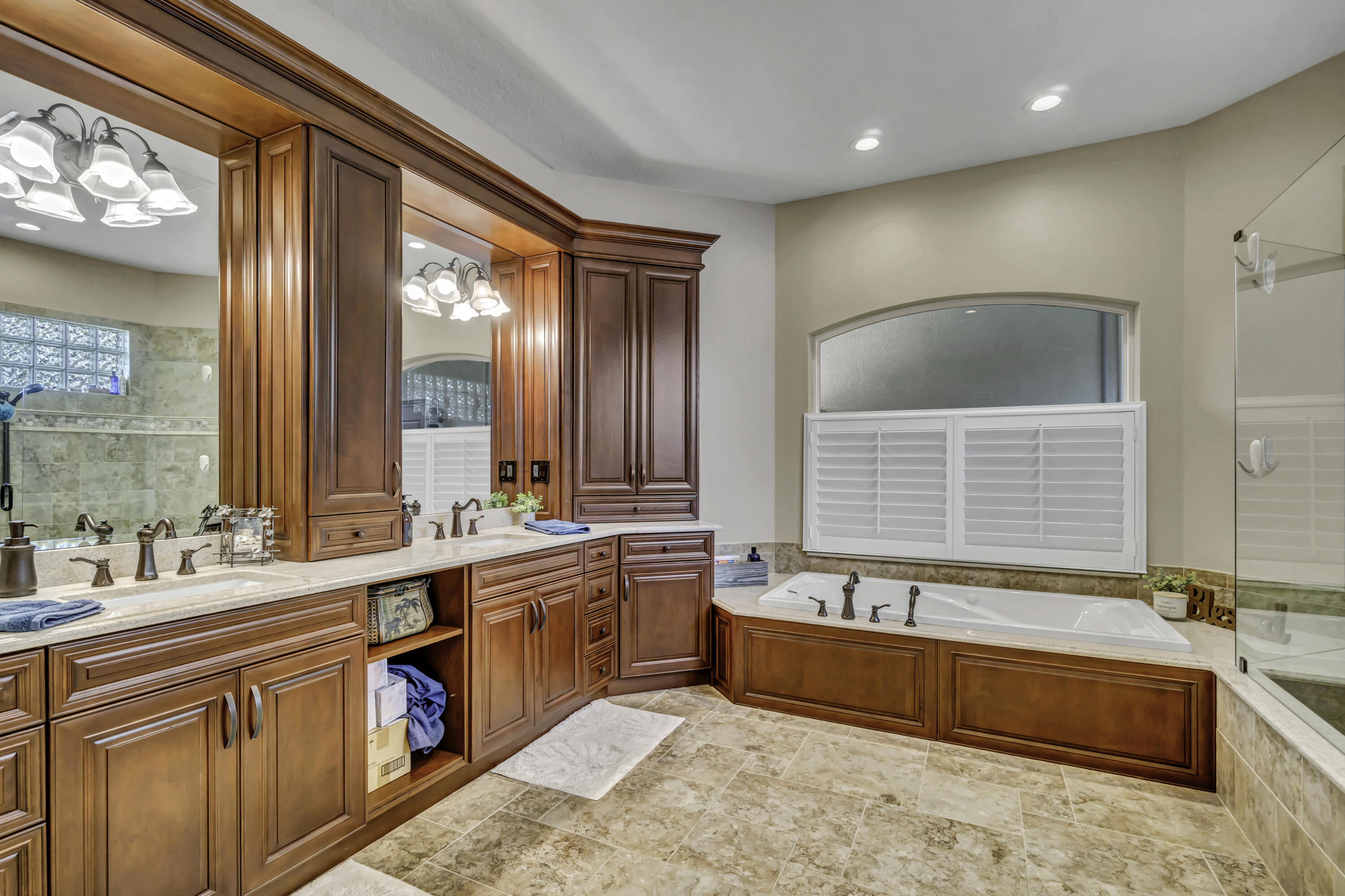 1209 Breakers W Boulevard West Palm Beach, FL 33411 - Photo 45 of 73 a bathroom with a large tub and sink