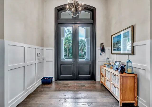 a kitchen with a stove and a wooden floors
