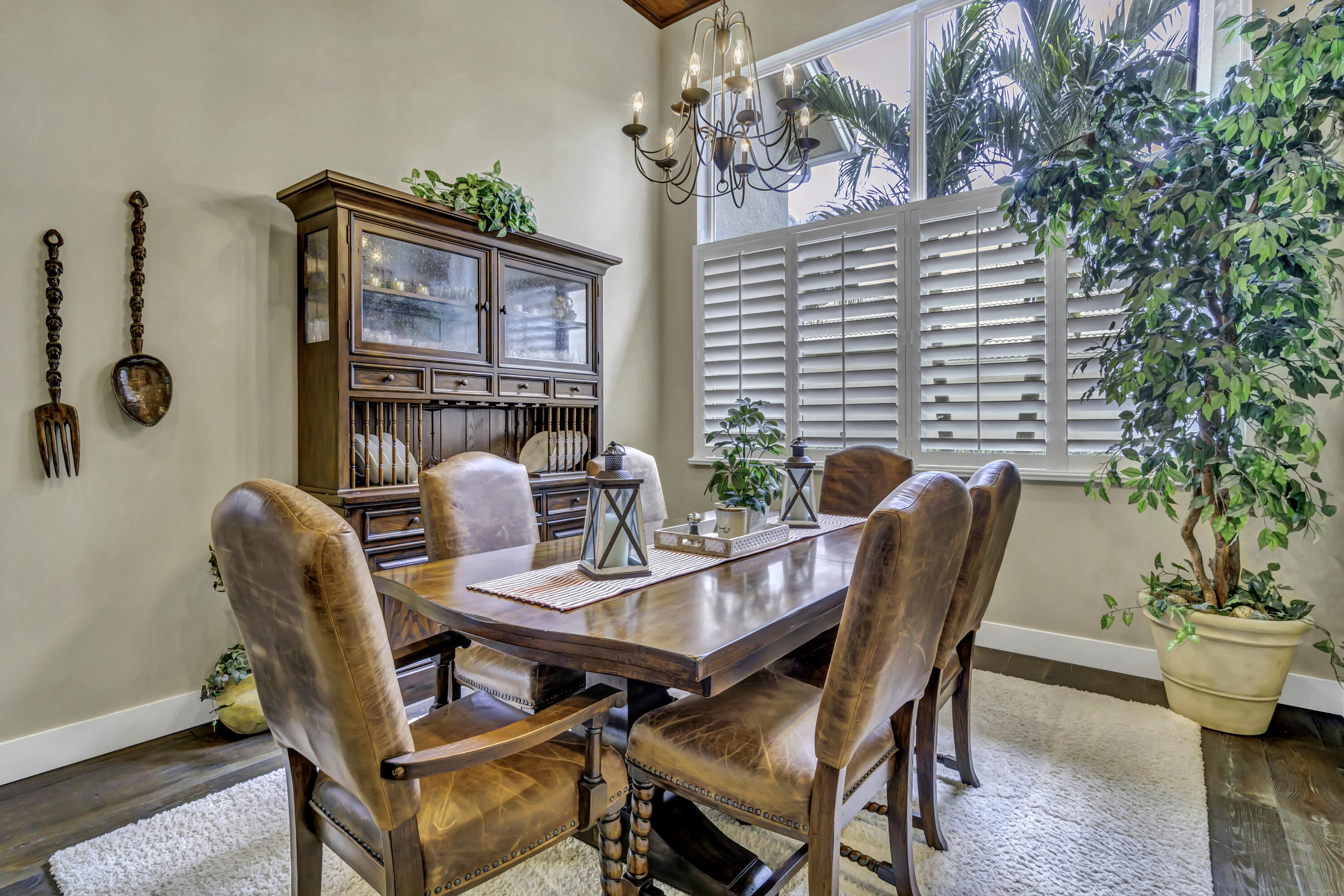1209 Breakers W Boulevard West Palm Beach, FL 33411 - Photo 53 of 73 a view of a patio with couple of chairs and a potted plant