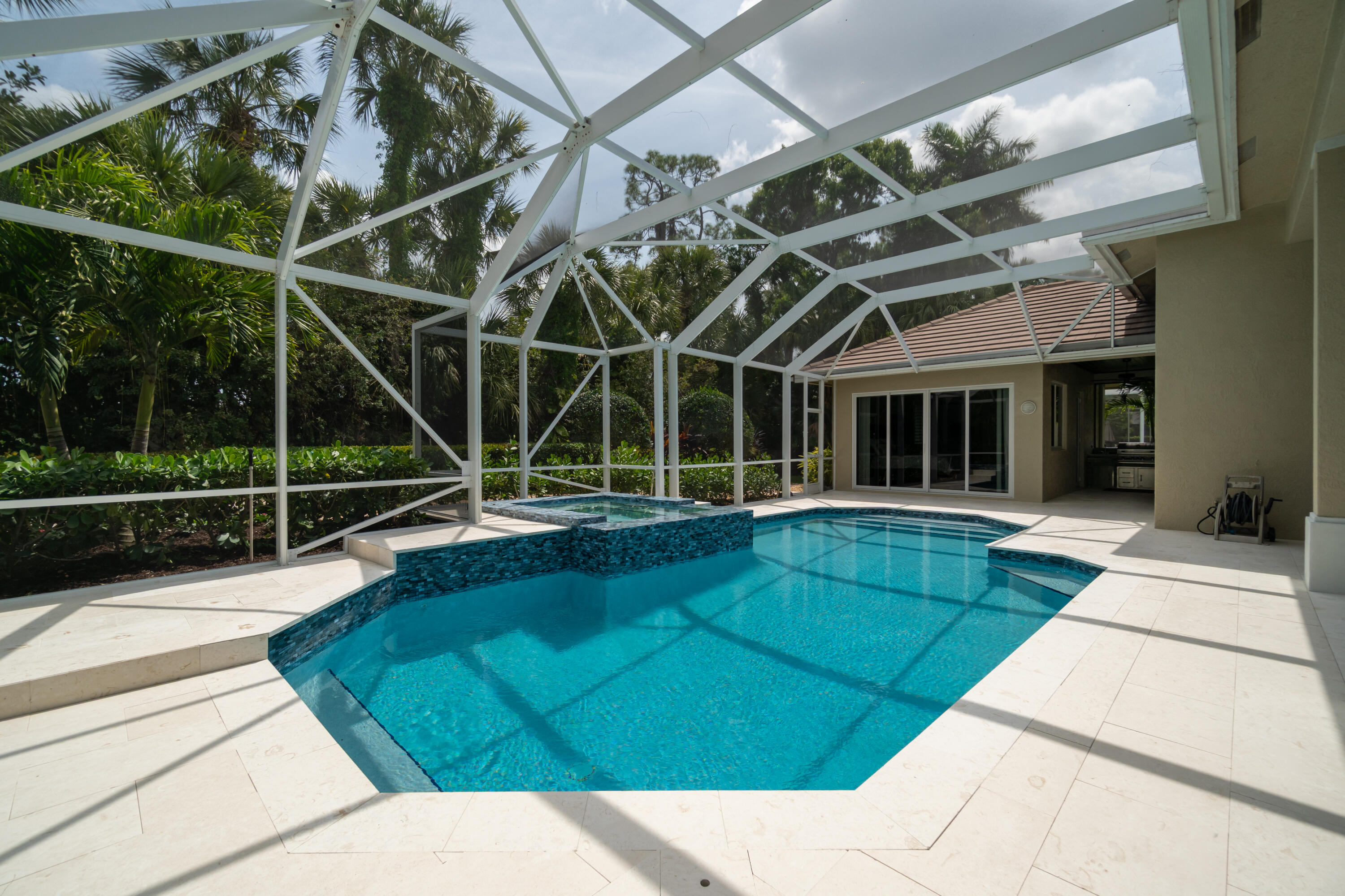 1209 Breakers W Boulevard West Palm Beach, FL 33411 - Photo 57 of 73 a view of a backyard with a swimming pool