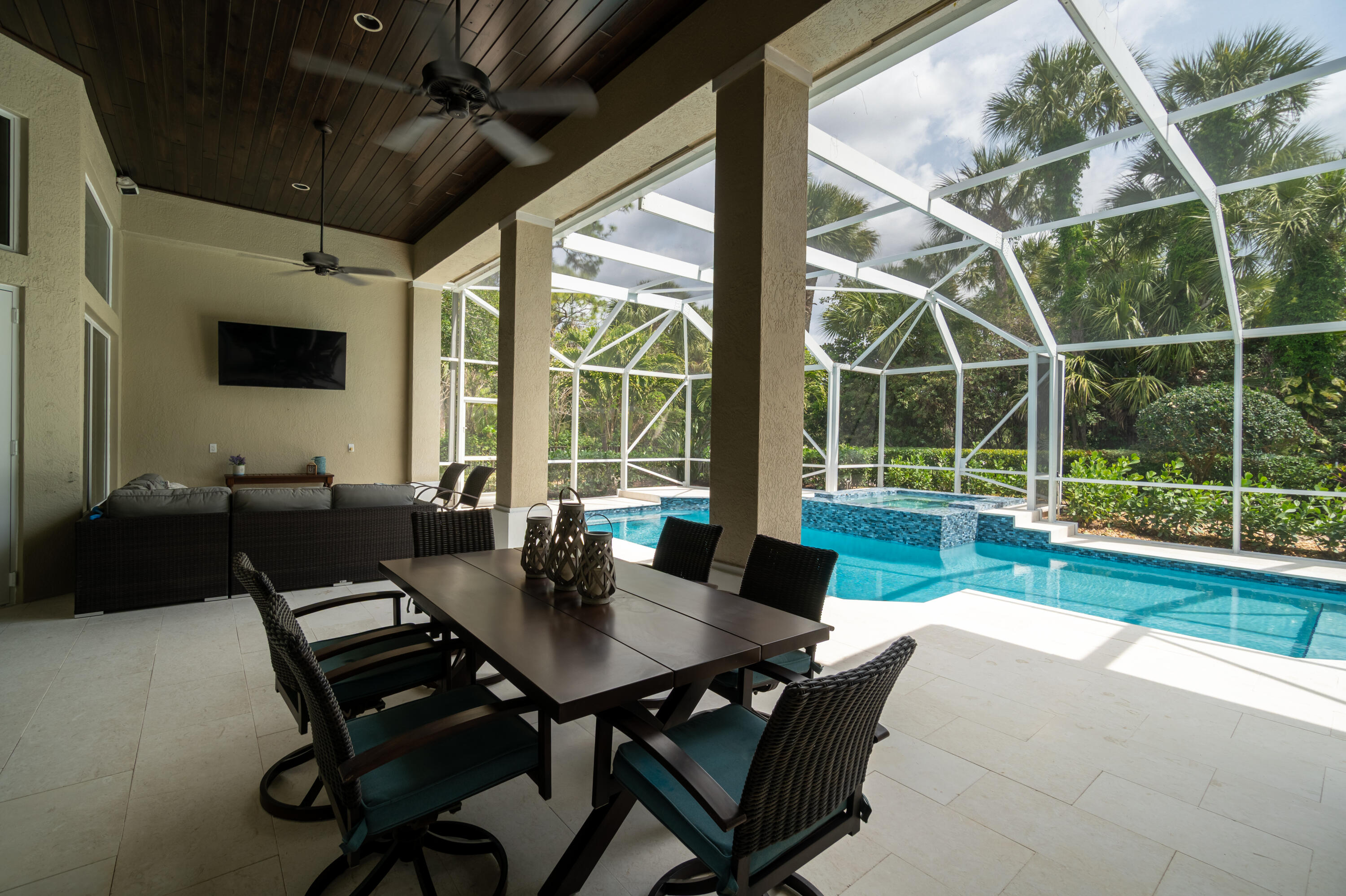 1209 Breakers W Boulevard West Palm Beach, FL 33411 - Photo 59 of 73 a view of a living room and dining room with furniture and floor to ceiling window