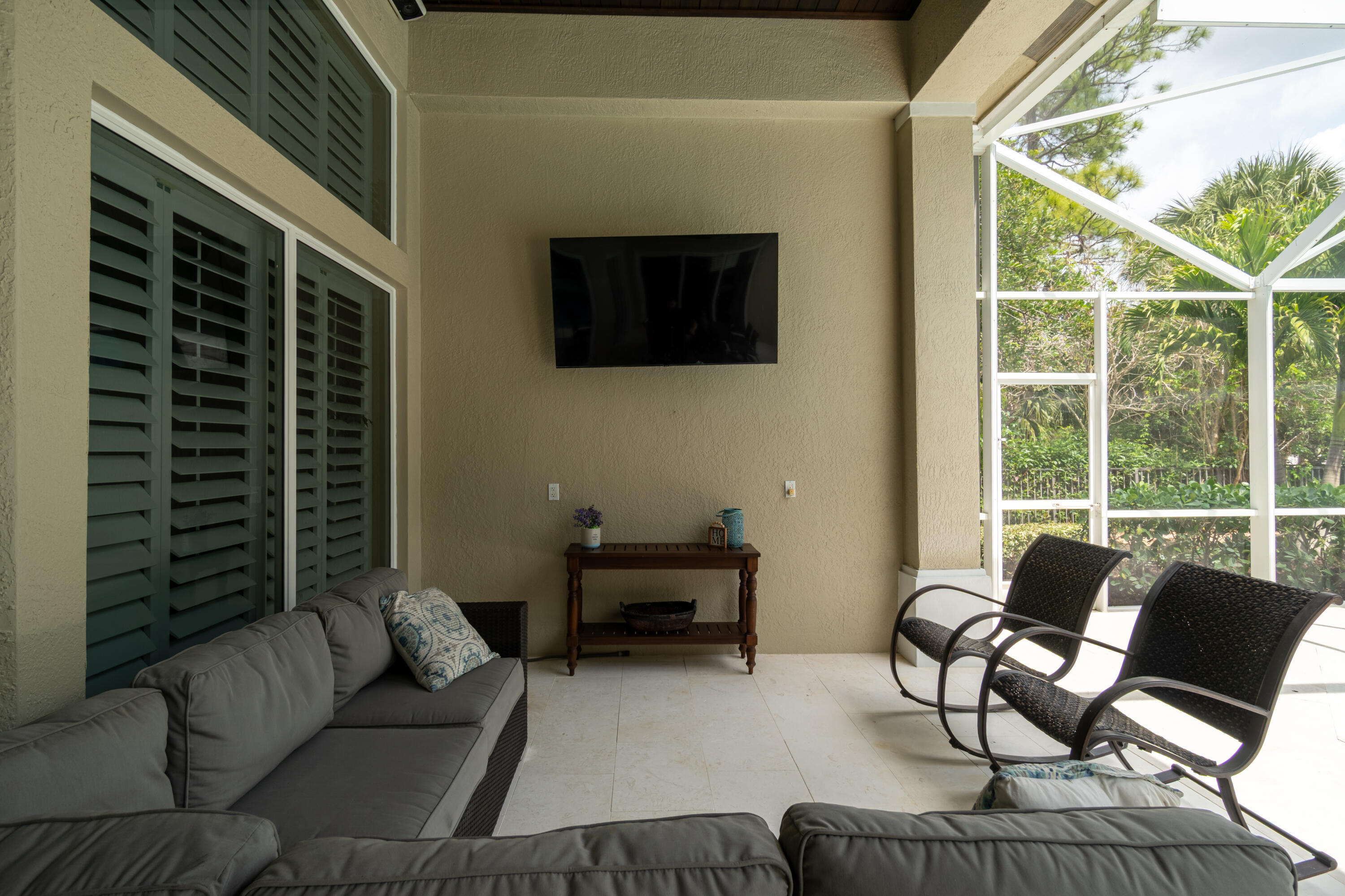 1209 Breakers W Boulevard West Palm Beach, FL 33411 - Photo 62 of 73 a living room with furniture and a flat screen tv