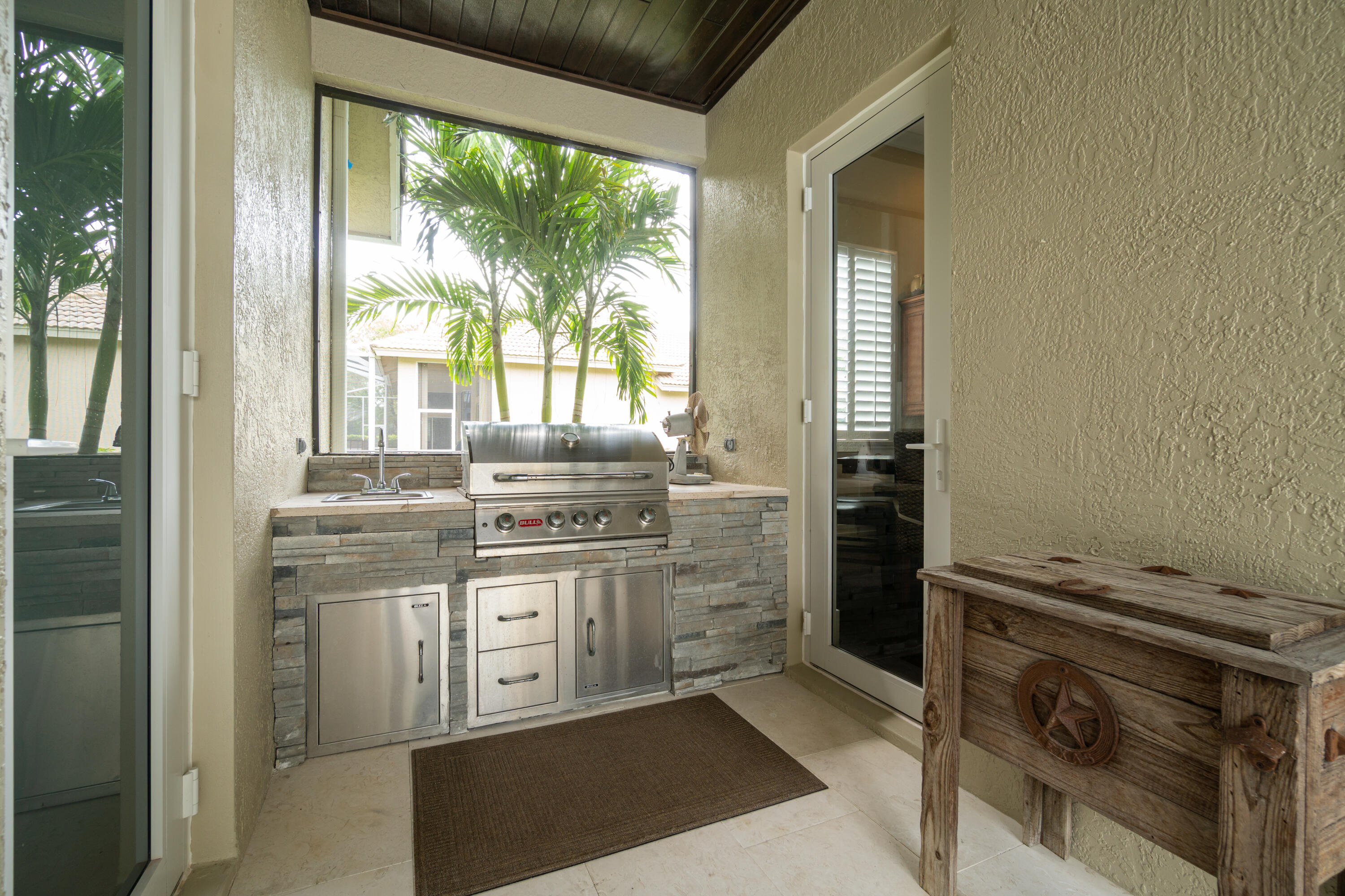 1209 Breakers W Boulevard West Palm Beach, FL 33411 - Photo 63 of 73 a kitchen with a stove and a wooden floors