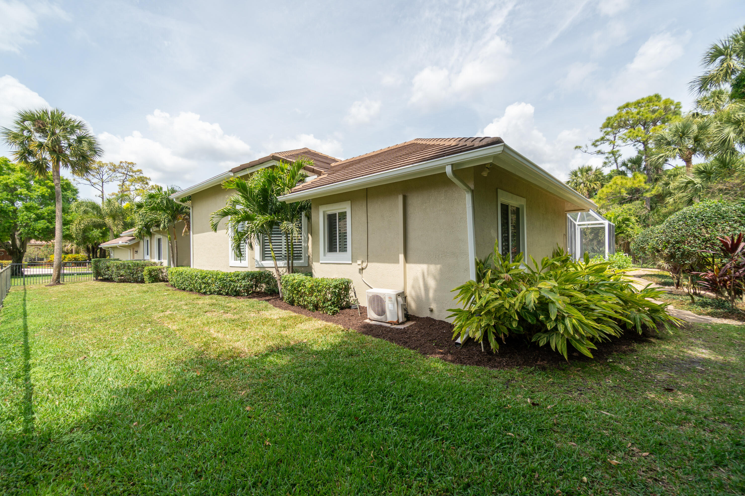 1209 Breakers W Boulevard West Palm Beach, FL 33411 - Photo 71 of 73 a front view of a house with a garden
