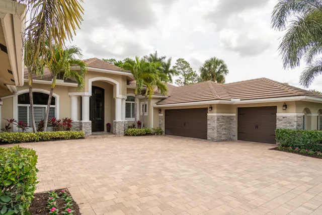 a house with palm tree in front of it