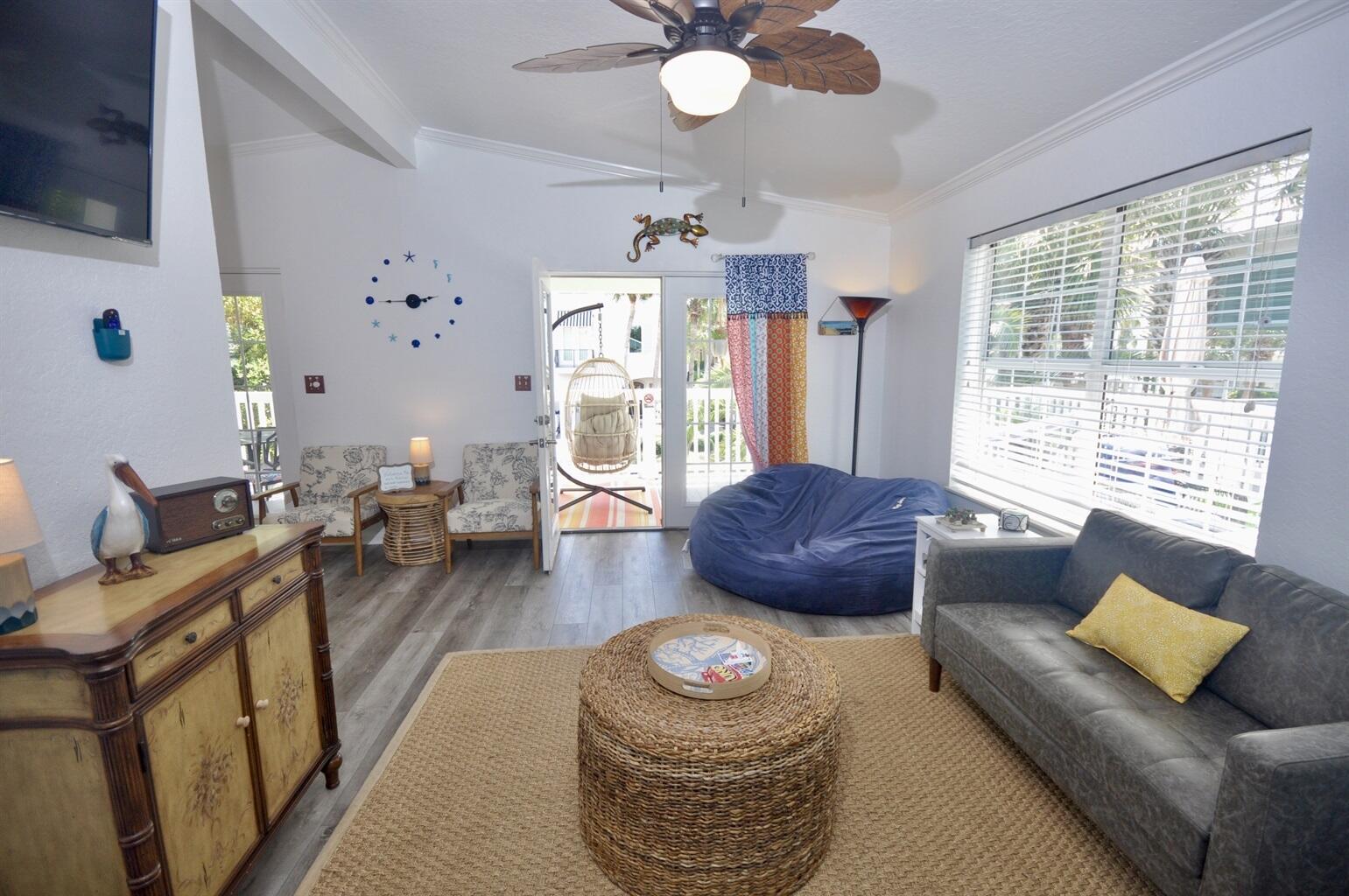 58 Los Angeles Street Miramar Beach, FL 32550 - Photo 12 of 36 a living room with furniture and a large window