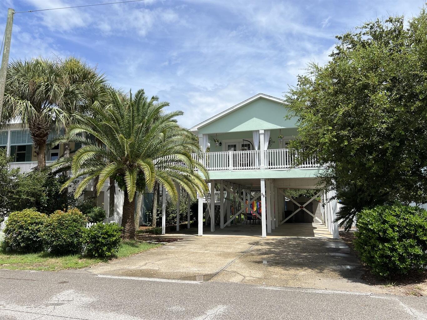 58 Los Angeles Street Miramar Beach, FL 32550 - Photo 2 of 36 a view of a house with a yard and potted plants