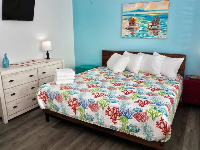 a bathroom with a sink mirror vanity and toilet