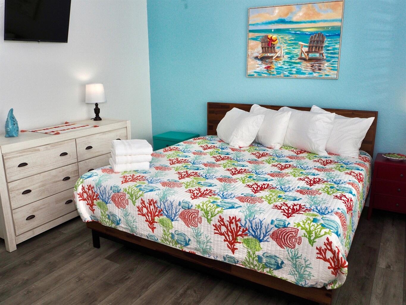 58 Los Angeles Street Miramar Beach, FL 32550 - Photo 24 of 36 a bedroom with a bed and a lamp on dresser