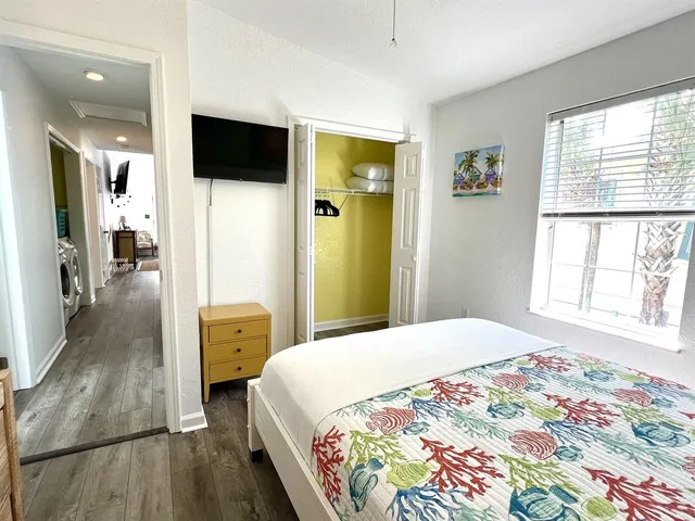 a view of entryway with wooden floor and dining room