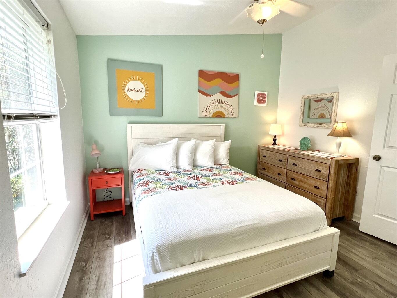 58 Los Angeles Street Miramar Beach, FL 32550 - Photo 29 of 36 a bedroom with a bed and wooden floor